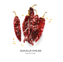 Creative layout made of guajillo chilies on the white background. Flat lay. Food concept.