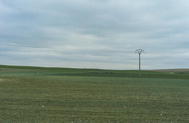 Fototapeta na wymiar An electric tower in a green land.
