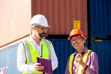 Business management discuss with foreman for communication before load container ship