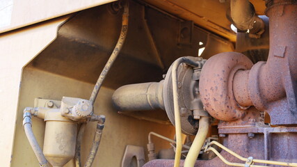Turbocharger of heavy machinery. Old diesel engine  turbine for boosting torque with parts in the...