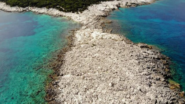 Alexia Beach With Clear Waters And Rocky Coastline At Summer In Greece. - aerial