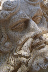 Fototapeta na wymiar Poseidon statue face in sunlight
