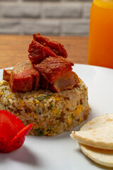 Rice with fried pork for Colombian gourmet breakfast