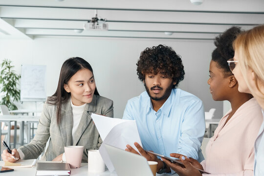 Diverse startup team business people executives group working together in office