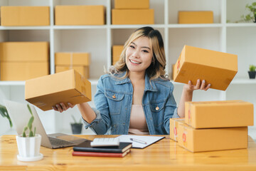 Online business,Work at home concept,SME,Asian business woman,checking customer order online shipping,Work at home.