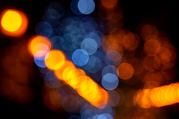 background blurred abstraction of colored lanterns and decorations. bokeh texture of street colored...