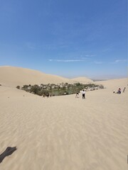 footprints in the sand dunes in Huacachina Perú