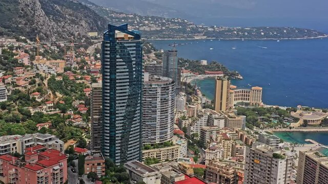 Monaco Aerial v21 birds eye view overlooking st roman neighborhood, capturing famous odeon tower and surrounding residential properties and resorts - July 2021