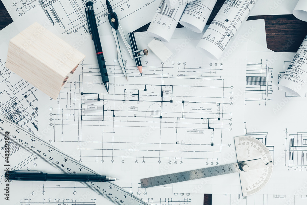 Wall mural mini model house, pencil, compass and roll blueprint plan on blueprint house plan design. architect 