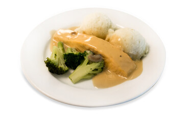 Salmon serve with truffle sauce and vegetable on white isolated.