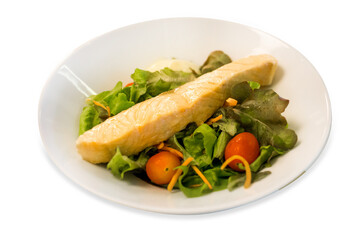 Die cut of Salmon serve with vegetable salad on white isolated.