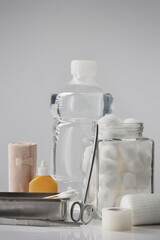 Bandage and first aid kit on white background...