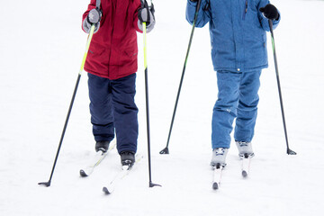 Little boys skiing with sticks, children's sports