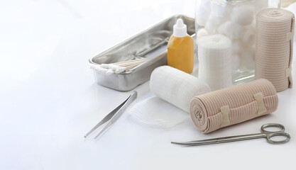 Bandage and first aid kit on white background...