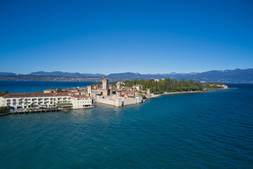 Naklejka na ściany i meble Sirmione aerial view. Top view of the historic center of the Sirmione peninsula, lake garda. Lake Garda, Sirmione, Italy. Italian castle on Lake Garda. Aerial panorama of Sirmione.