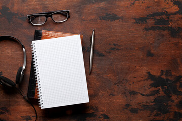 Blank notepad and headset