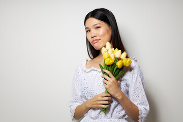 pretty brunette in a white shirt flowers spring posing isolated background unaltered