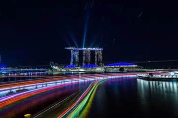 Tuinposter City view at Singapore central area at night with light trails. © hit1912