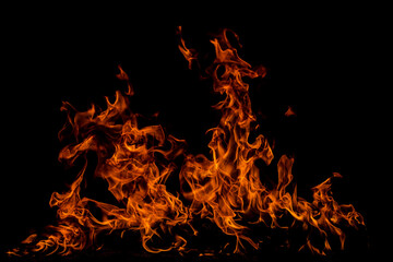 Fototapeta na wymiar Fire flames on black background. Fire burn flame isolated, abstract texture. Flaming effect with burning fire.