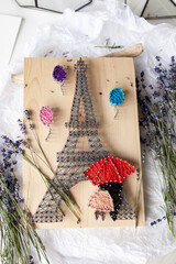 Wooden panel in string art technique, thread pattern, handmade
