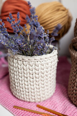 Fototapeta na wymiar crochet baskets for the home of cord and knitted yarn