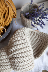 Fototapeta na wymiar Knitted shell from a light cord, handmade