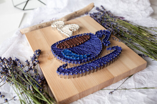 Wooden panel in string art technique, thread pattern, handmade