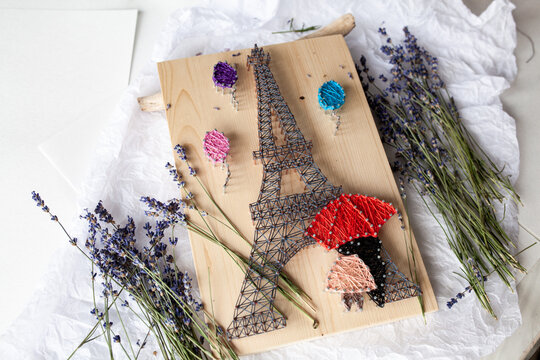 Wooden panel in string art technique, thread pattern, handmade