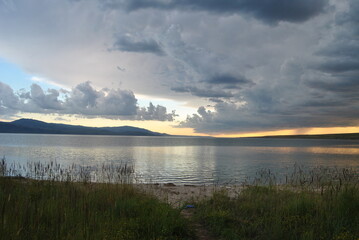 Beautiful sunset. Sunset on the sea, lake. Evening landscape.