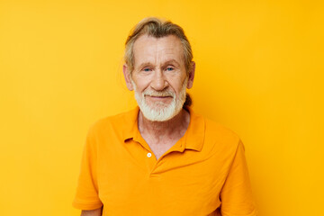 Obraz premium Photo of retired old man with a gray beard emotion gestures hands isolated background