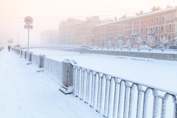 Street view with a coast of Griboedov canal on a winter day