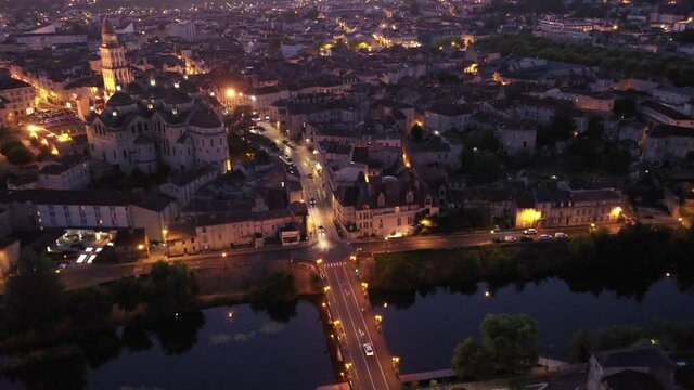 Aerial view of Perigueux city illuminated at night, Perigord Blanc, Dordogne. High quality 4k footage