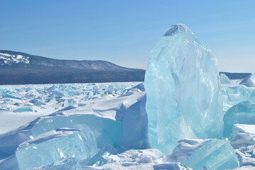 The blue ice of Lake Baikal. Baikal in winter. Transparent and clean ice of Lake Baikal.