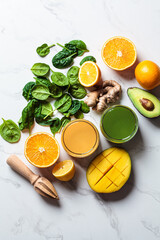 Orange ginger smoothie and green spinach smoothie. Detox drinks concept.