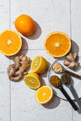 Flat lay of ingredients for cooking ginger, lemon and orange juice. Detox drink concept.