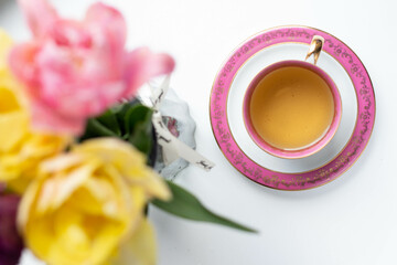 tea with fresh flowers in cup
