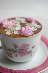 tea with fresh flowers in cup