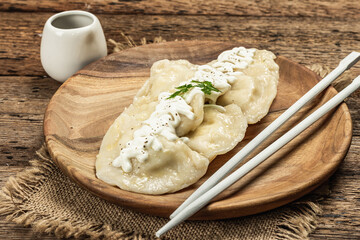 Traditional Dumplings with soy sauce. Traditional Oriental cuisine
