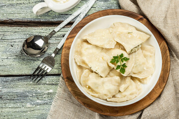 Dumplings with cottage cheese and sour cream