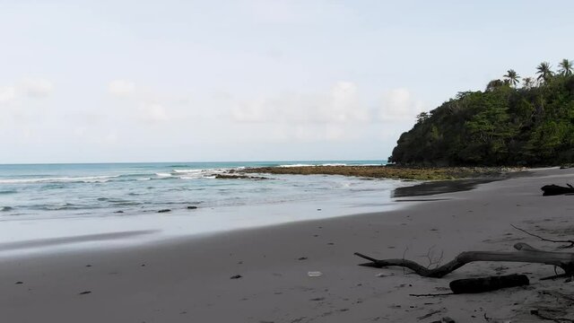 Forward Flying Aerial Drone Shot At Bavang Jamal Beach, Next To The Tip Of Borneo. Flying Between Trees Revealing The Beach. Kudat, Malaysian Borneo