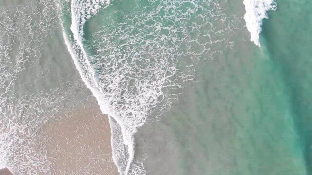 Straight Down Looking Drone Shot At Bavang Jamal Beach, Next To The Tip Of Borneo. Showing The Waves Hitting The Sand. Kudat, Malaysian Borneo