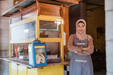 proud muslim woman with her small food stall