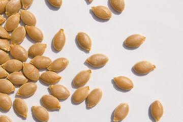 close up Sweet pumpkin seeds isolated white background.