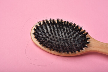 Dirty hair brush, Grey lint dead skin cell residue on unclean comb, Poor hygiene head scalp, Hair fall problem.