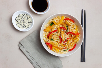 Udon noodles with chicken, pepper and sesame. Chinese food.