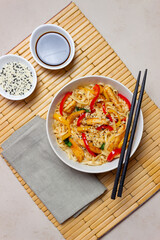 Udon noodles with chicken, pepper and sesame. Chinese food.