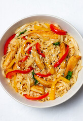 Udon noodles with chicken, pepper and sesame. Chinese food.