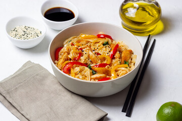 Udon noodles with chicken, pepper and sesame. Chinese food.