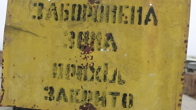 Footage of a closed area of a military airfield with old decommissioned Su-24 fighters. The inscription on the yellow table "Forbidden zone. The passage is closed.