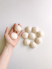 hand holding a bowl of mushrooms